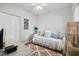 Cozy bedroom featuring a comfortable daybed with decorative pillows and wicker furniture at 6208 Sweetwater Blvd. # 6208, Murrells Inlet, SC 29576