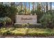 Attractive Sweetwater community sign surrounded by lush greenery and trees at 6208 Sweetwater Blvd. # 6208, Murrells Inlet, SC 29576