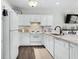 Bright kitchen with granite countertops, white appliances, tile backsplash, and a black faucet at 6208 Sweetwater Blvd. # 6208, Murrells Inlet, SC 29576