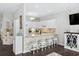 Modern kitchen with white cabinets, breakfast bar seating, and stainless steel appliances at 6208 Sweetwater Blvd. # 6208, Murrells Inlet, SC 29576