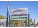 View of the Marsh Walk welcome sign with surrounding buildings and local businesses at 6208 Sweetwater Blvd. # 6208, Murrells Inlet, SC 29576