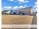 Spacious backyard featuring full yard irrigation system and grass at 644 Serendipity Circle, Murrells Inlet, SC 29576