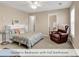 Upstairs bedroom includes en suite bathroom, window, and decorative bed at 644 Serendipity Circle, Murrells Inlet, SC 29576