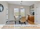 Breakfast nook adjacent to screened-in patio, featuring a chandelier and cabinetry at 644 Serendipity Circle, Murrells Inlet, SC 29576