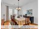 Open dining room features a classic chandelier and ample natural light at 644 Serendipity Circle, Murrells Inlet, SC 29576