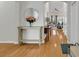 Welcoming foyer with hardwood floors and a decorative mirror creates an elegant entrance at 644 Serendipity Circle, Murrells Inlet, SC 29576