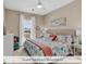 Guest bedroom featuring coastal decor, fan and natural light at 644 Serendipity Circle, Murrells Inlet, SC 29576