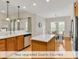 Spacious kitchen featuring quartz countertops and a stainless steel dishwasher at 644 Serendipity Circle, Murrells Inlet, SC 29576