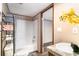 Bright bathroom with a shower and tub combination and stylish granite vanity at 6461 Norton Rd., Green Sea, SC 29545