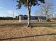 View of the light gray siding and yellow steps on this cozy home at 6461 Norton Rd., Green Sea, SC 29545