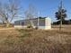 View of the light gray siding and steps on this cozy home at 6461 Norton Rd., Green Sea, SC 29545