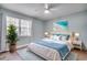 Bright bedroom features a ceiling fan, beachy décor, and lots of natural light at 6644 E Sweetbriar Trail, Myrtle Beach, SC 29588