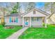 Charming single-story home featuring blue shutters, a well-manicured lawn, and a welcoming entrance at 6644 E Sweetbriar Trail, Myrtle Beach, SC 29588