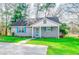 Charming single-story home with blue shutters, a well-maintained lawn, and a welcoming front entrance at 6644 E Sweetbriar Trail, Myrtle Beach, SC 29588