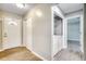 Hallway with wood-look floors, a closet, and laundry area at 6644 E Sweetbriar Trail, Myrtle Beach, SC 29588