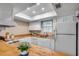 Bright kitchen featuring wood countertops, white cabinetry, stainless steel appliances, and a sky light at 6644 E Sweetbriar Trail, Myrtle Beach, SC 29588