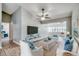 Spacious living room featuring a ceiling fan, comfortable seating, and stylish decor with an open layout and natural light at 6644 E Sweetbriar Trail, Myrtle Beach, SC 29588