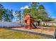 Community playground with a wooden playset, perfect for outdoor fun and recreation at 6644 E Sweetbriar Trail, Myrtle Beach, SC 29588