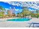 A beautiful community pool area with a bath house for convenience and relaxation under blue skies at 6644 E Sweetbriar Trail, Myrtle Beach, SC 29588