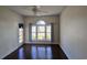 Bright bedroom with dark hardwood floors and view at 703 Riverwalk Dr. # 103, Myrtle Beach, SC 29579