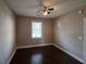 Simple bedroom with dark hardwood floors at 703 Riverwalk Dr. # 103, Myrtle Beach, SC 29579