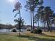 Scenic waterfront view with lush landscaping and trees at 703 Riverwalk Dr. # 103, Myrtle Beach, SC 29579