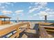 Beach access featuring wooden walkway and gazebo at 719 N Waccamaw Dr., Garden City Beach, SC 29576