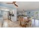 Open floor plan, dining area leads into living room and kitchen at 719 N Waccamaw Dr., Garden City Beach, SC 29576