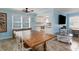 Charming dining area with modern table set and kitchen view at 719 N Waccamaw Dr., Garden City Beach, SC 29576