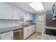 Clean kitchen shows stainless appliances, undermount sink and subway tile backsplash at 719 N Waccamaw Dr., Garden City Beach, SC 29576