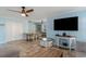 Open-concept living area with dining space and modern decor at 719 N Waccamaw Dr., Garden City Beach, SC 29576
