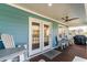 Spacious covered porch featuring furniture, ceiling fan, and room for entertaining at 719 N Waccamaw Dr., Garden City Beach, SC 29576