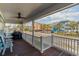 Relaxing covered porch with ceiling fan and scenic neighborhood views at 719 N Waccamaw Dr., Garden City Beach, SC 29576