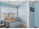 Bright sitting area includes a comfortable sofa, accent furniture and a large window at 719 N Waccamaw Dr., Garden City Beach, SC 29576