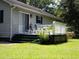 Back deck, with chairs, is a perfect spot for outdoor relaxation and entertaining at 76 Nailah Ln., Pawleys Island, SC 29585