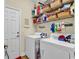 Laundry room with washer, dryer, and ample shelving at 799 Helms Way, Conway, SC 29526