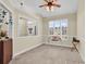 Home office featuring a desk, window with plantation shutters and ceiling fan at 799 Helms Way, Conway, SC 29526