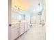 Modern bathroom featuring marble floors, white cabinets, and a glass-enclosed shower at 8304 Parasol Ct., Myrtle Beach, SC 29579