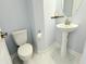 Charming powder room featuring a pedestal sink and marble tile floors at 8304 Parasol Ct., Myrtle Beach, SC 29579