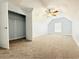 Bedroom featuring sloped ceiling, neutral carpet, window, and closet with an open door at 8304 Parasol Ct., Myrtle Beach, SC 29579