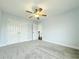 Bedroom features a ceiling fan, neutral walls, carpet, and closet at 8304 Parasol Ct., Myrtle Beach, SC 29579