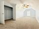Cozy attic bedroom with plush carpet, angled ceilings, and closet at 8304 Parasol Ct., Myrtle Beach, SC 29579