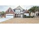 Charming brick home with an attached garage, well-maintained lawn, and mature landscaping at 8304 Parasol Ct., Myrtle Beach, SC 29579