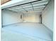 Clean and spacious garage with a painted floor and shelving at 8304 Parasol Ct., Myrtle Beach, SC 29579