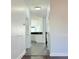 View of the hallway with access to the kitchen with gray tile flooring at 8304 Parasol Ct., Myrtle Beach, SC 29579