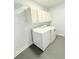 Laundry room with washer, dryer, and cabinets at 8304 Parasol Ct., Myrtle Beach, SC 29579