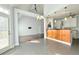 Bright, open-concept living room flowing seamlessly into kitchen area and showcasing door to the outside at 8304 Parasol Ct., Myrtle Beach, SC 29579
