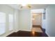 Living room with hardwood floors, lots of light, and a view of the stairs at 8304 Parasol Ct., Myrtle Beach, SC 29579