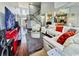 Bright, open-concept living room boasts a modern staircase, high ceilings, and comfortable white seating at 8304 Parasol Ct., Myrtle Beach, SC 29579