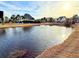Picturesque pond view showcasing mature trees, a fountain, and surrounding greenery at 8304 Parasol Ct., Myrtle Beach, SC 29579